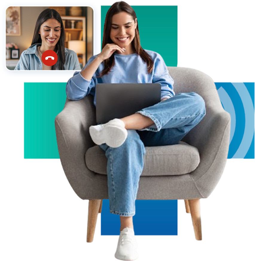 Woman sitting in chair using laptop for telehealth